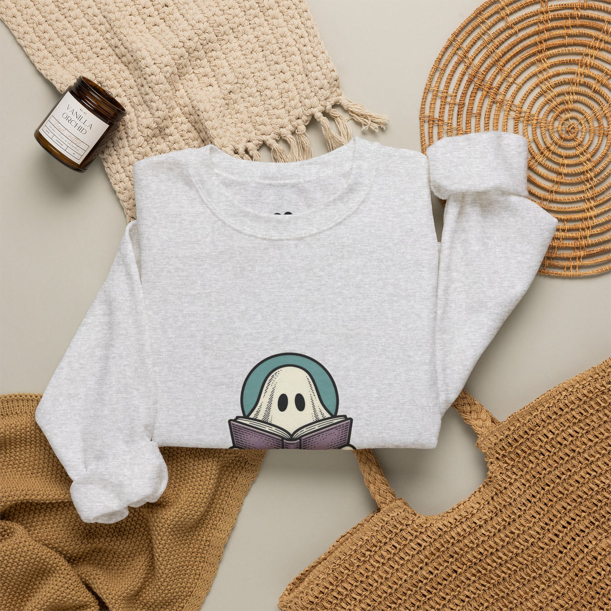 Ash I'm Not Ignoring You ghost sweatshirt in a cozy flat lay with a candle and knit blanket