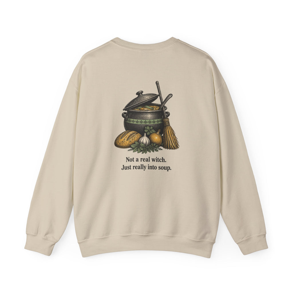 Back of the Sand Kitchen Witch sweatshirt showing a soup pot and broom and “Not a real witch. Just really into soup.”
