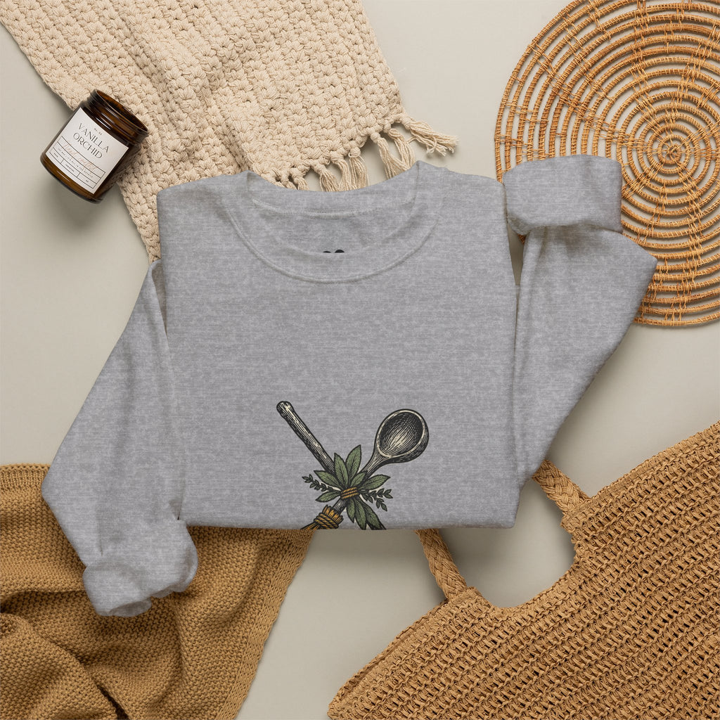 Model wearing the Sport Grey Kitchen Witch sweatshirt, two-sided crewneck by Kindred Oddities