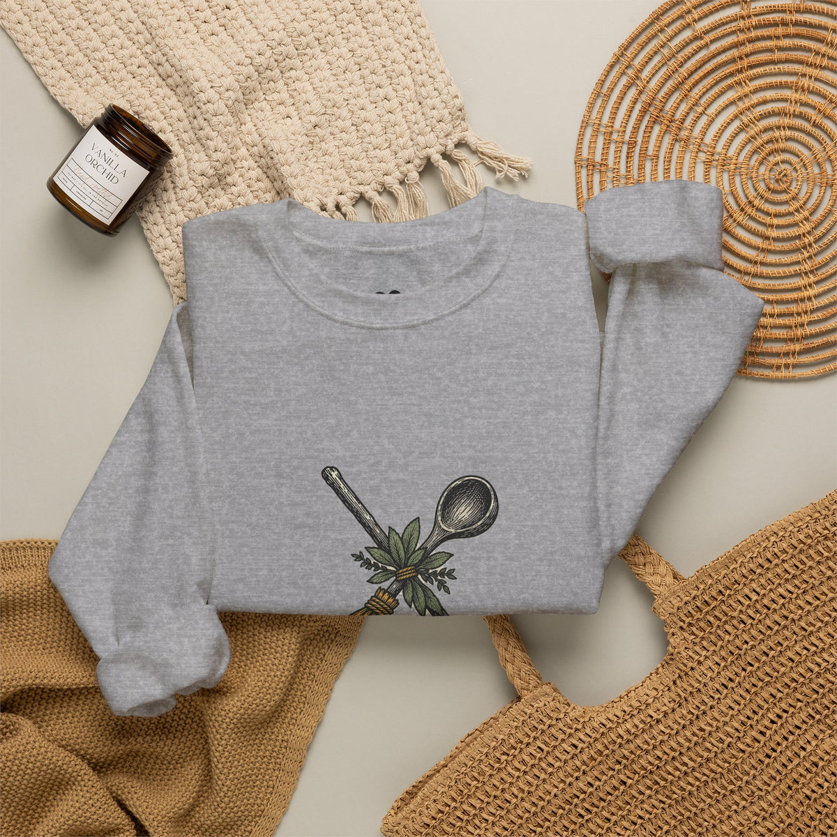 Model wearing the Sport Grey Kitchen Witch sweatshirt, two-sided crewneck by Kindred Oddities