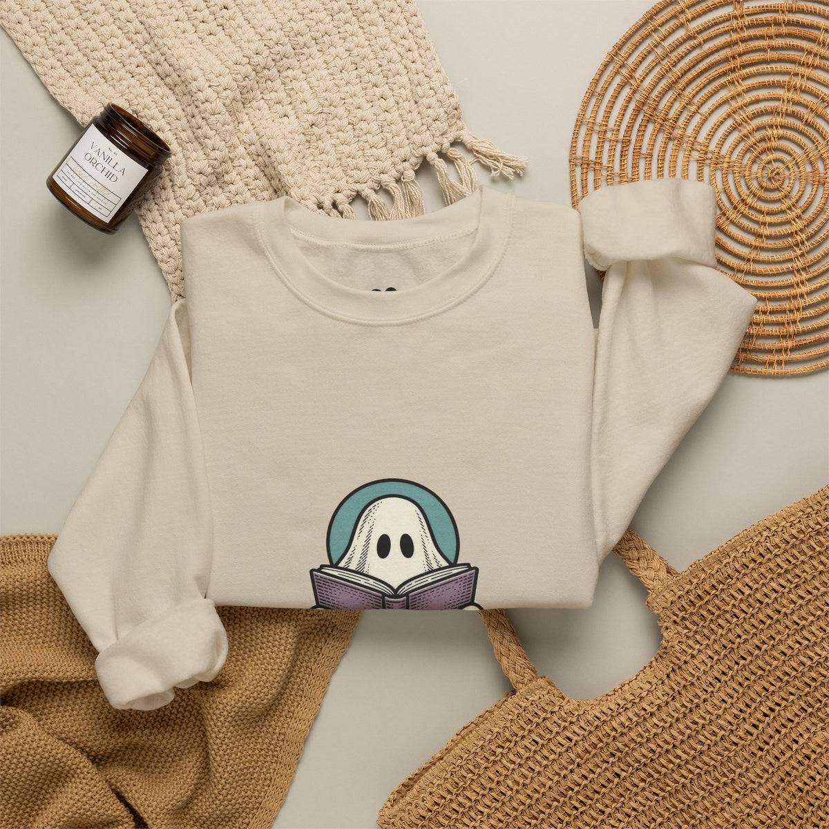 Sand I'm Not Ignoring You ghost sweatshirt in a cozy flat lay with a candle and knit blanket