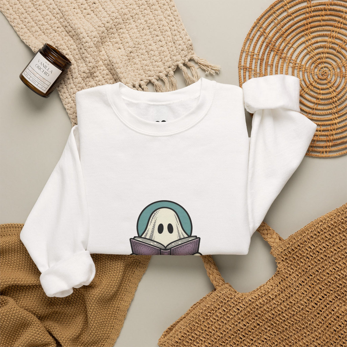 White I'm Not Ignoring You ghost sweatshirt in a cozy flat lay with a candle and knit blanket